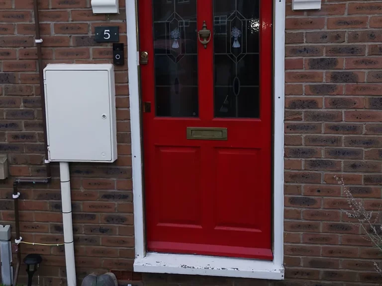 Before: an old red front door with leaded glass
